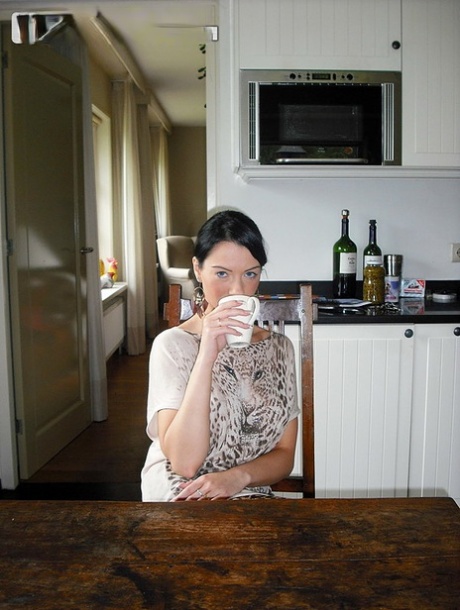 Brunette amateur exposes her wet pussy after drinking wine from coffee cups