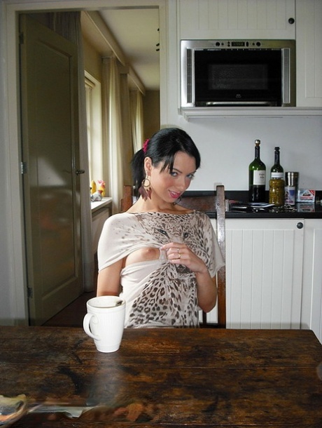 Brunette amateur exposes her wet pussy after drinking wine from coffee cups