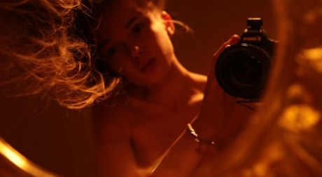 Alluring babe shows her hairy pussy while taking naked selfies in a mirror