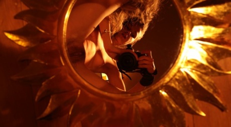 Alluring babe shows her hairy pussy while taking naked selfies in a mirror