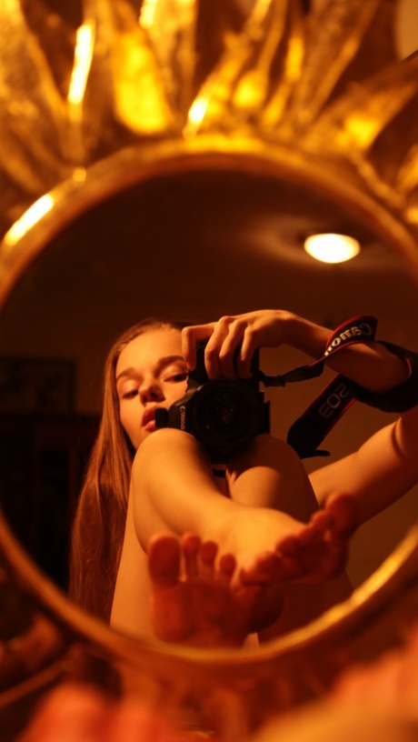 Alluring babe shows her hairy pussy while taking naked selfies in a mirror
